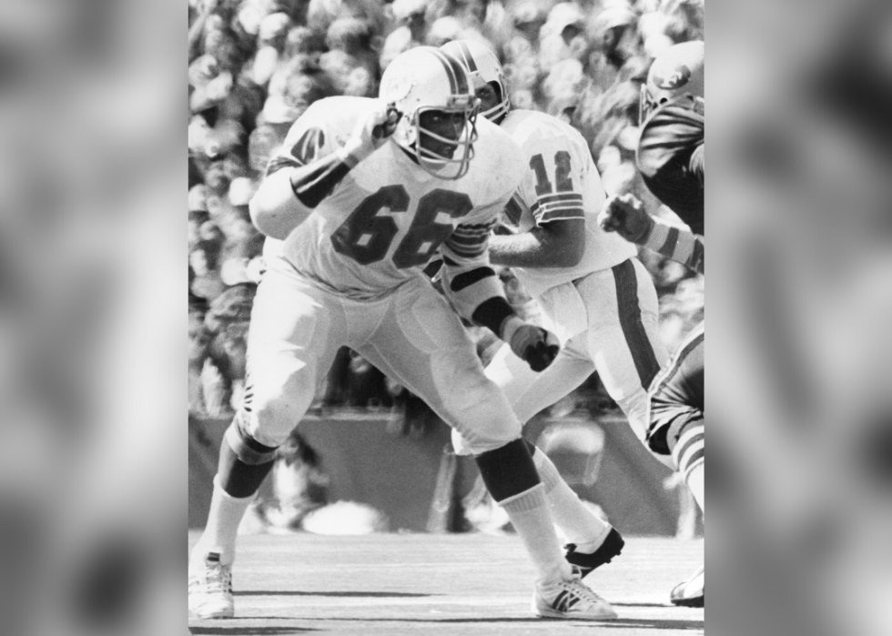 Guard Larry Little #66 of the Miami Dolphins protects the quarterback during a game circa 1970s.