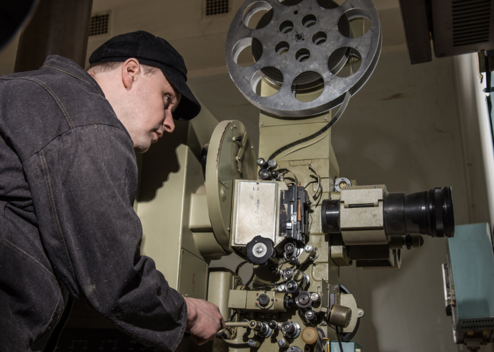 A projectionist at work in theater.