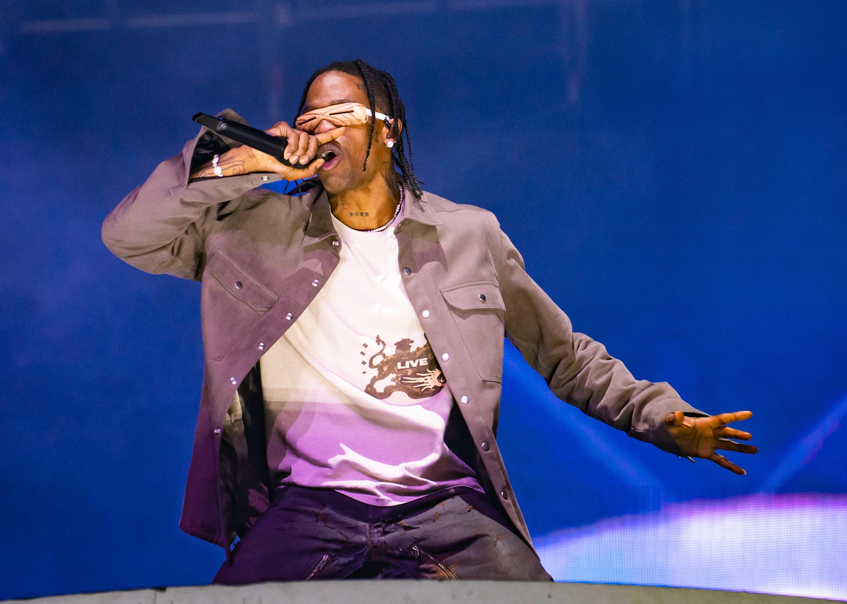 Travis Scott performing onstage.