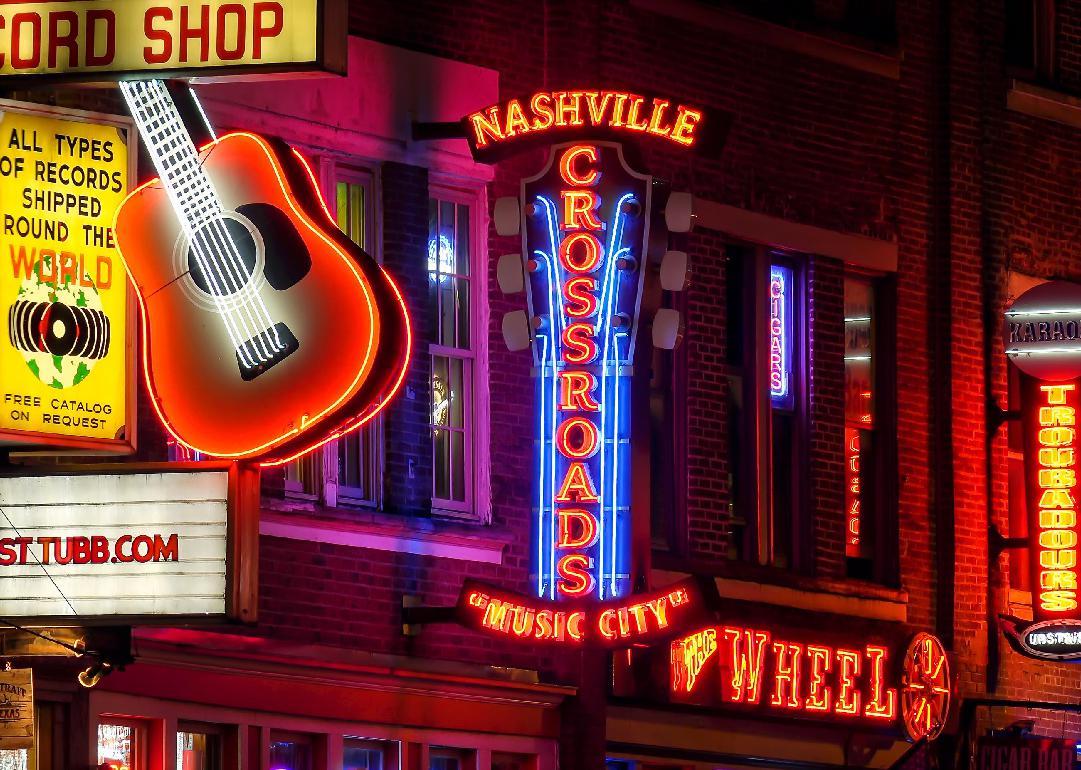 Neon signs at night along Broadway Street in Nashville.