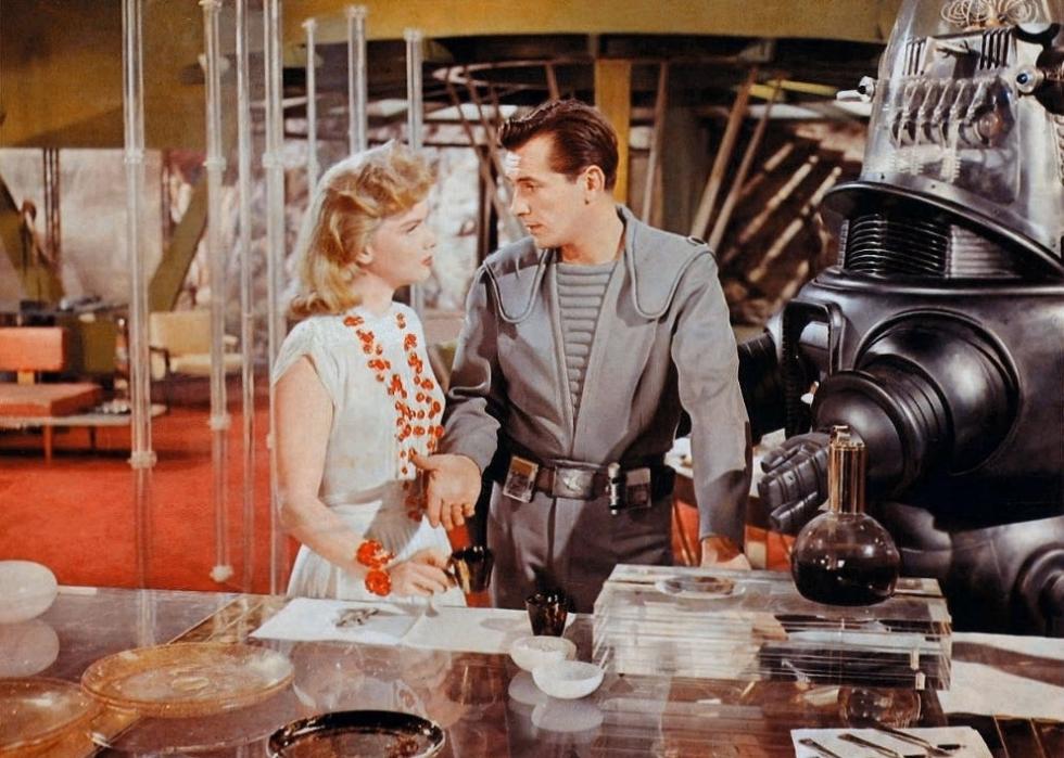 Anne Francis, Jack Kelly, and Robby the Robot in a scene from "Forbidden Planet"