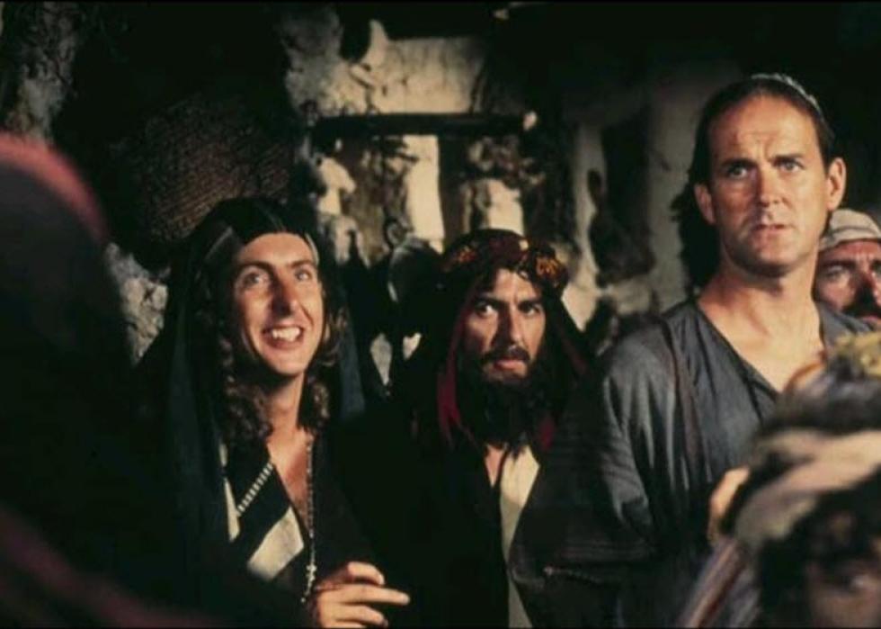 George Harrison, John Cleese and Eric Idle in a scene from "Life of Brian"