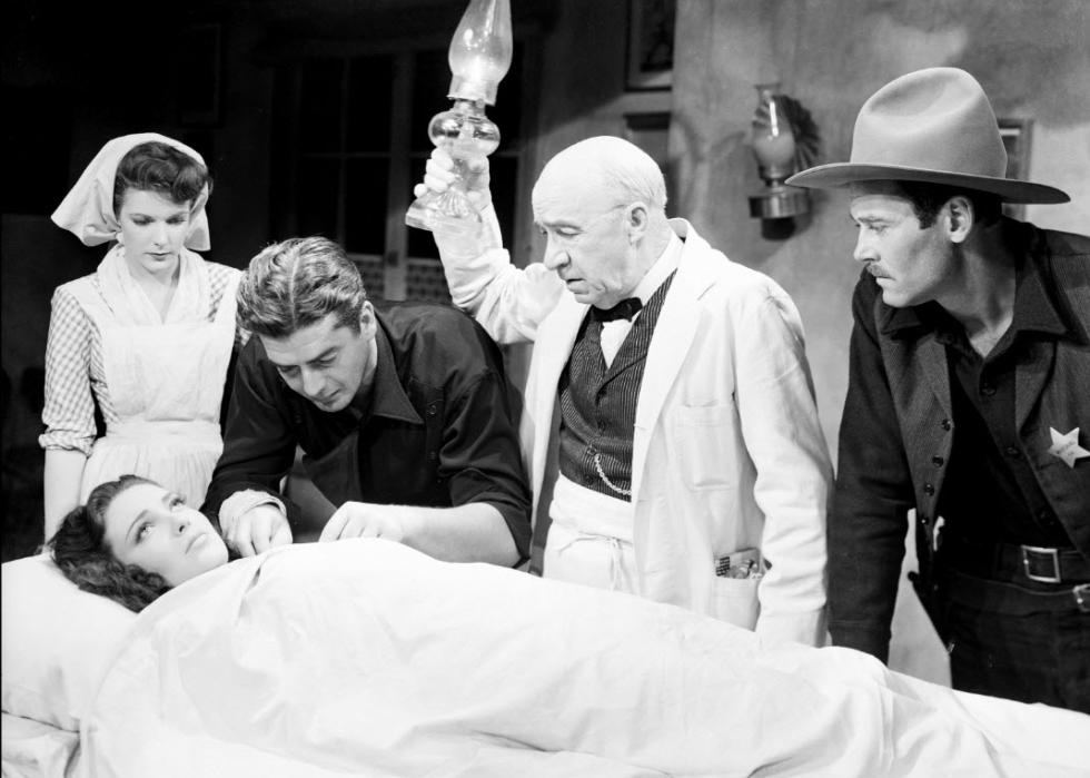Henry Fonda, Linda Darnell, Victor Mature, Cathy Downs, and J. Farrell MacDonald in a scene from "My Darling Clementine"