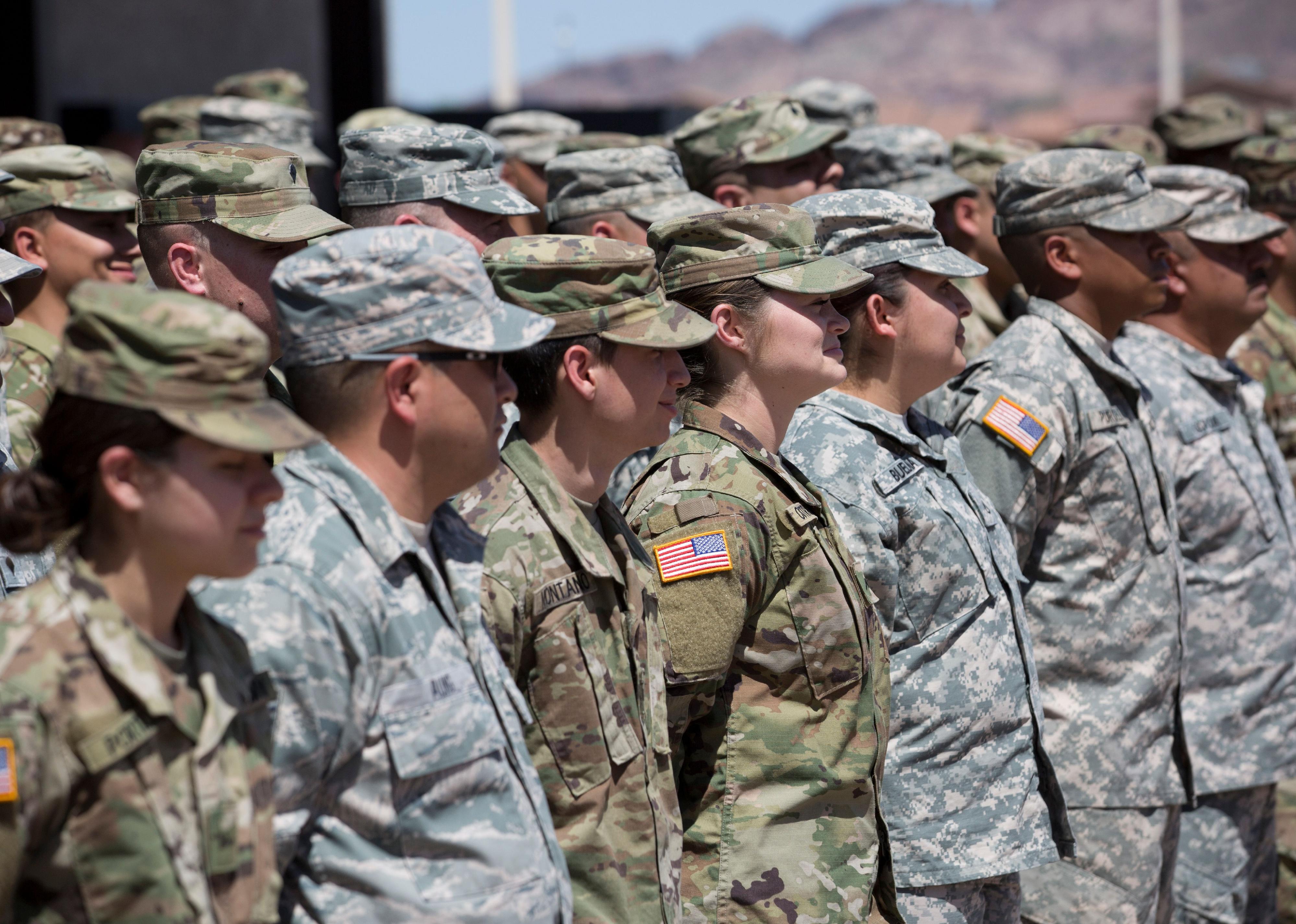 National Guard members listening to a speech.