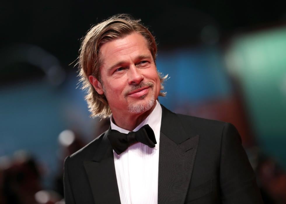 Brad Pitt dressed in black tie at a red carpet event.