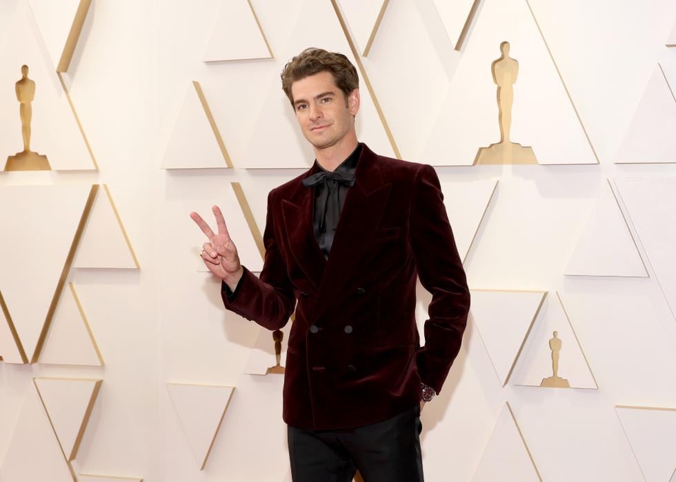 Andrew Garfield poses at the Academy Awards.