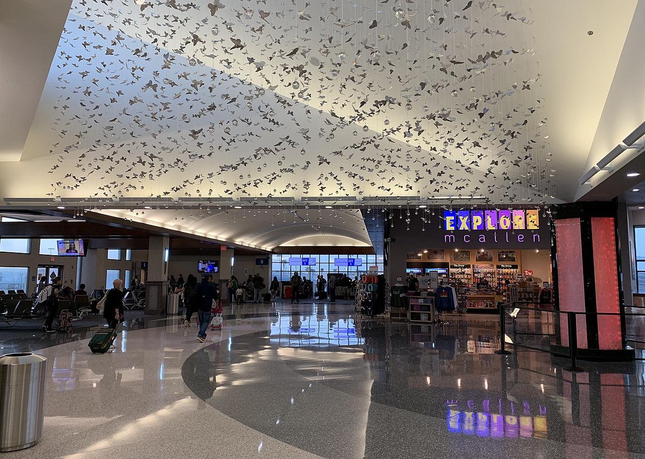 Interior of the McAllen airport with butterflies hanging from the ceiling.
