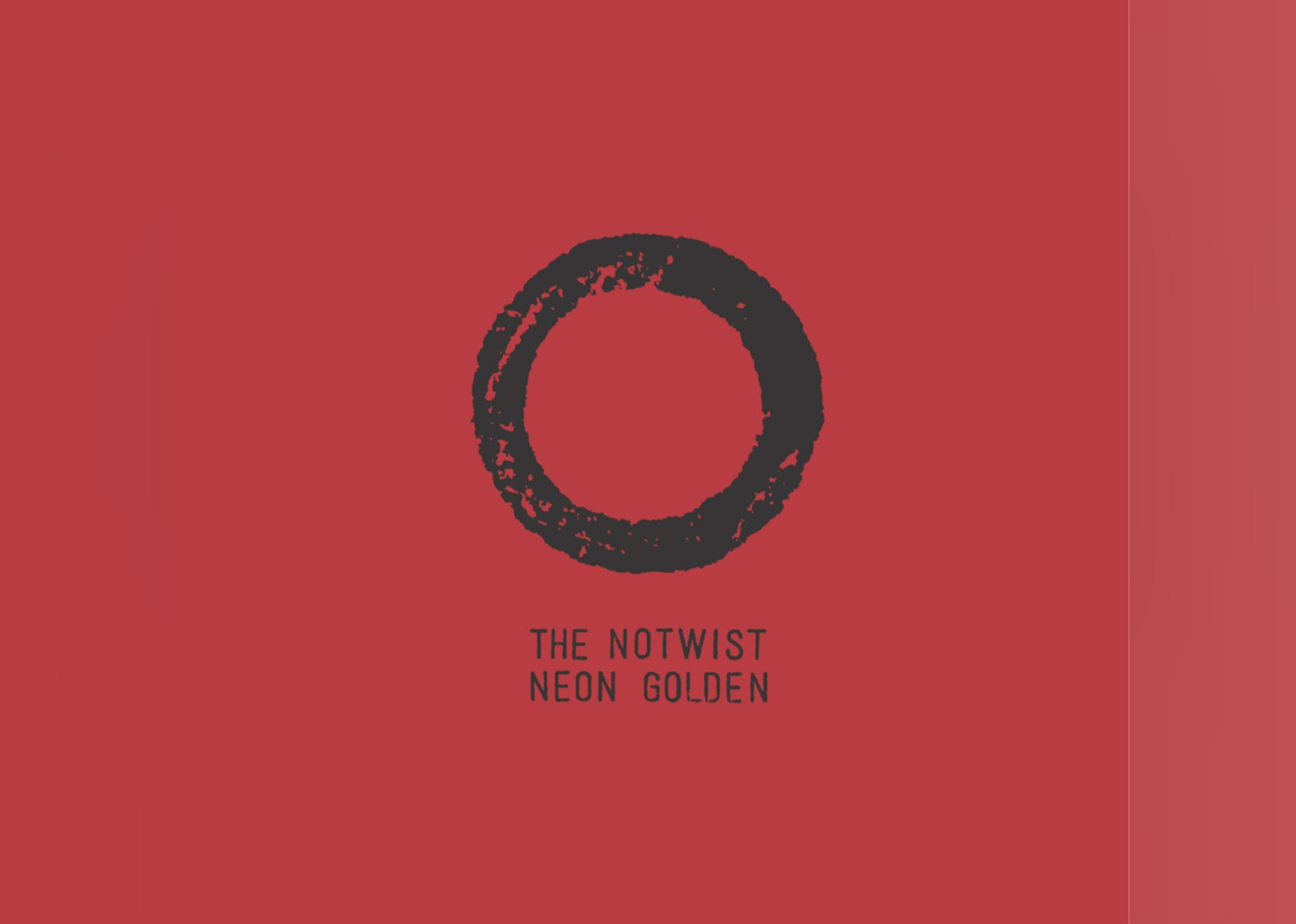 The name of the Album on a red background with a black circle in the middle.