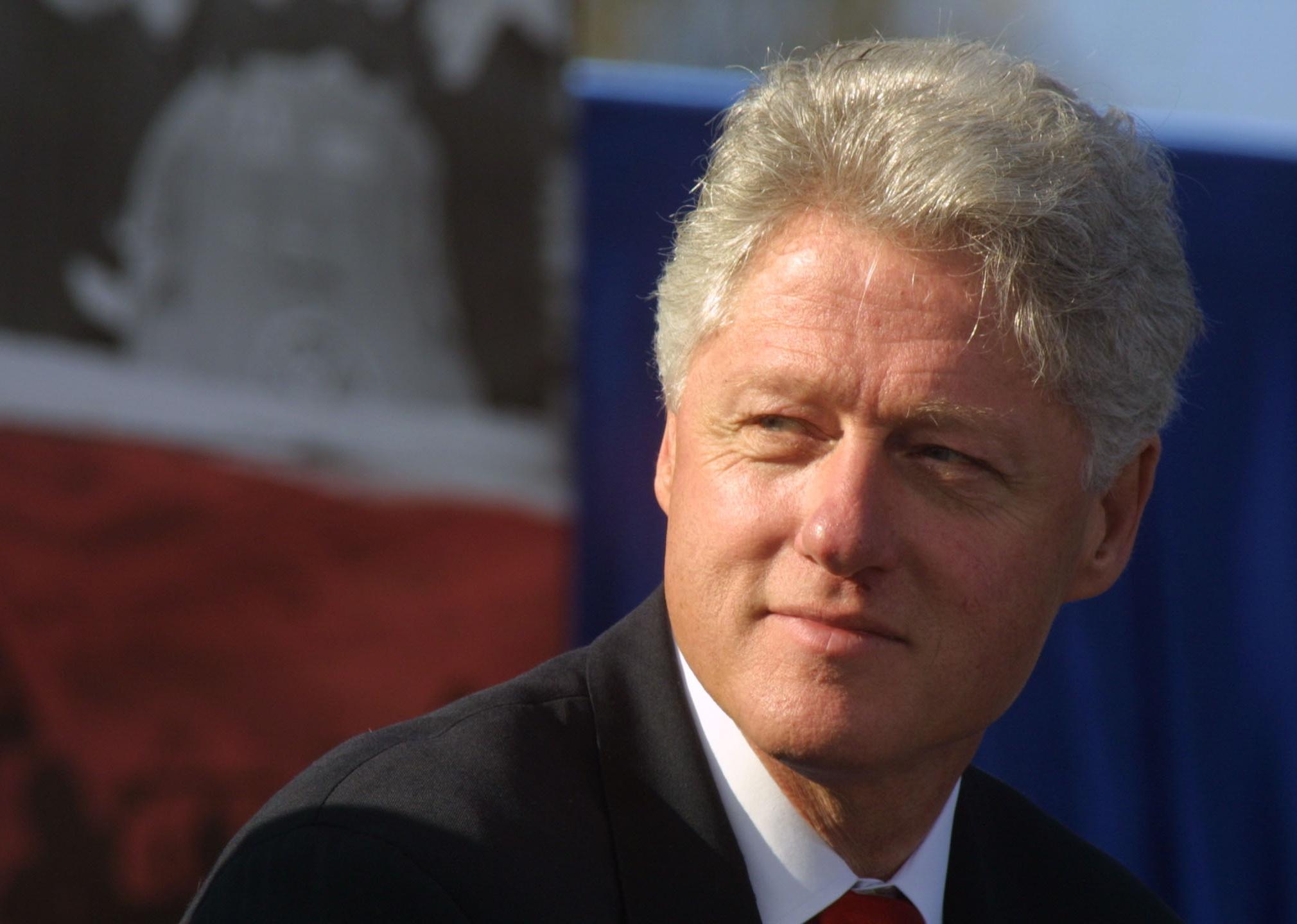 William J. Clinton smiling.