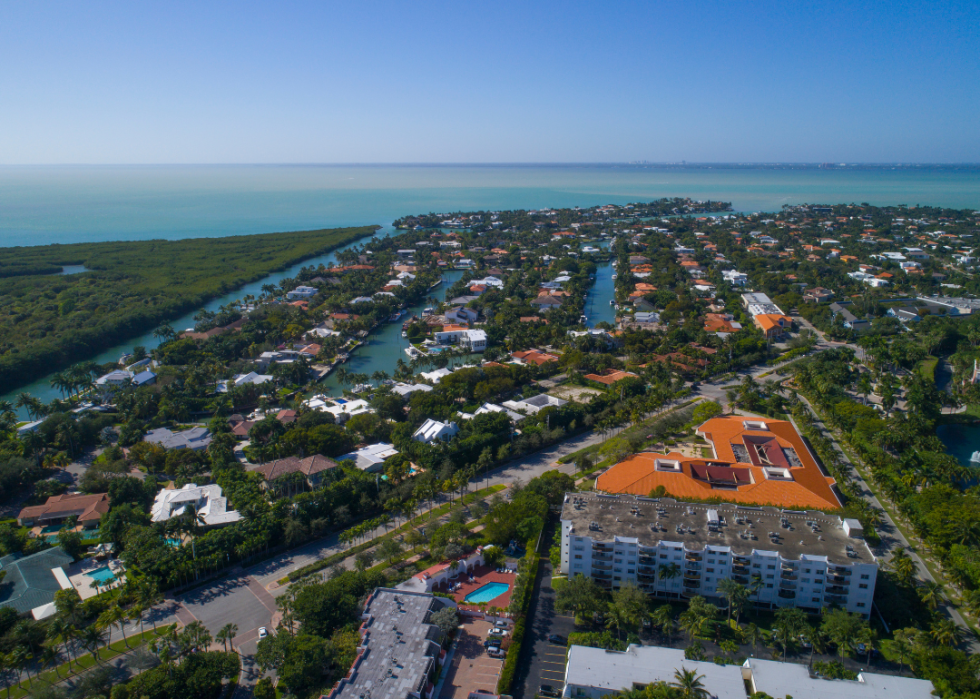 Aerial view of rows of homes on the water.
