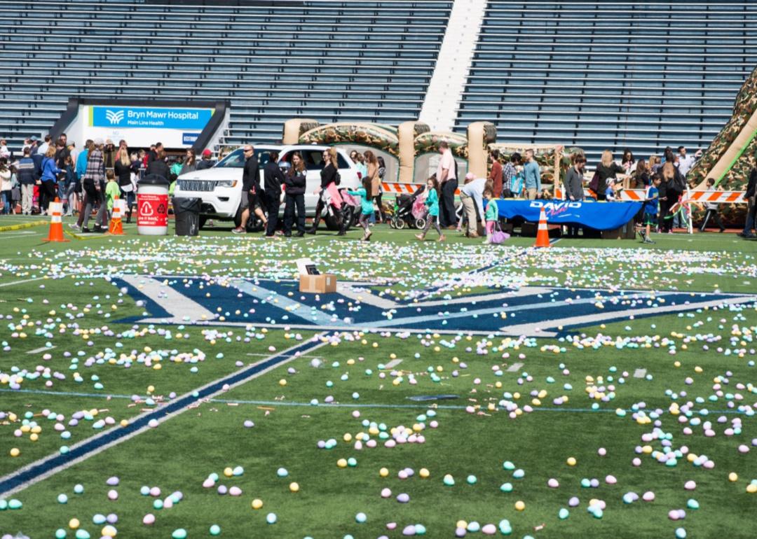 A giant easter egg hunt in a stadium.