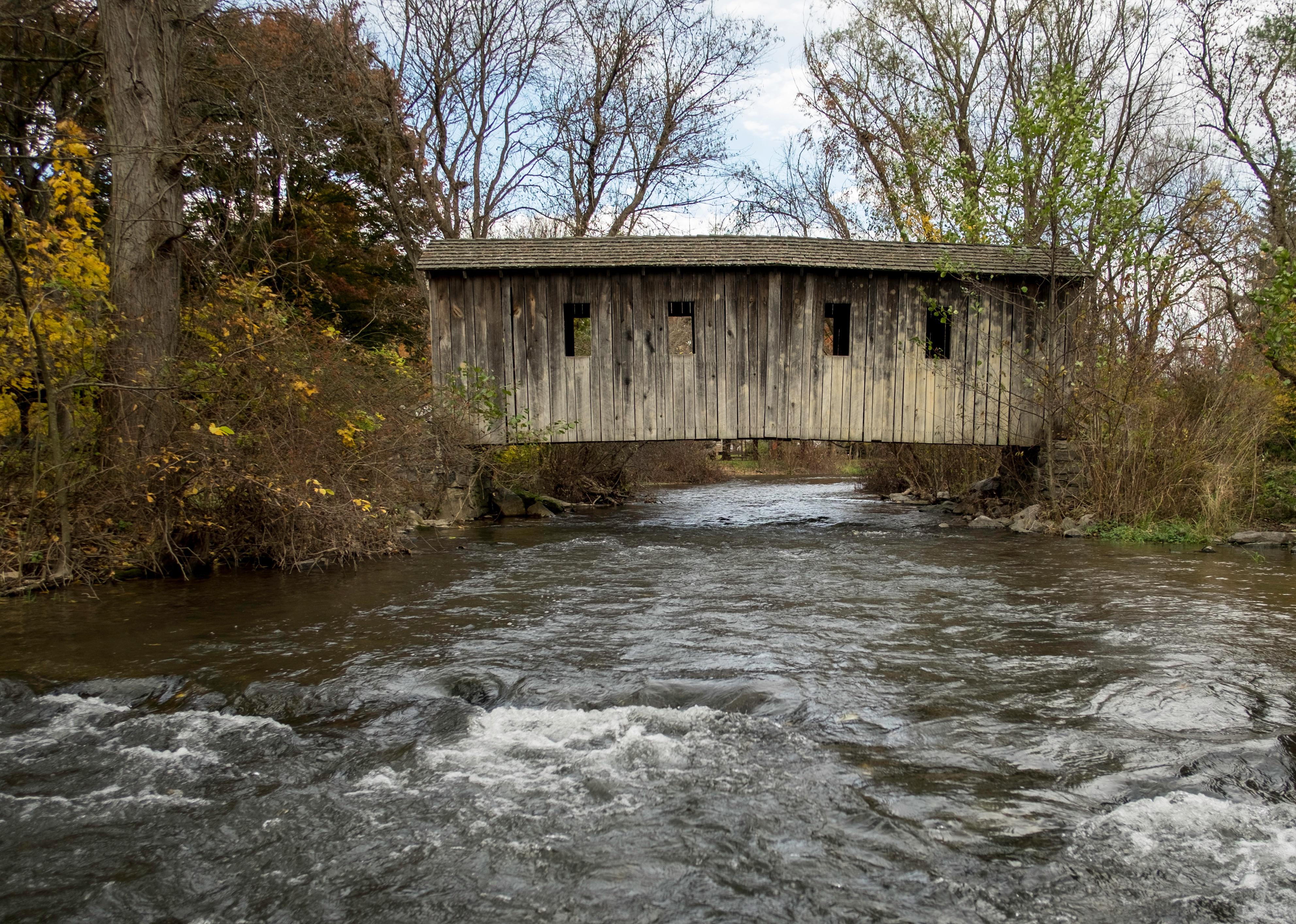 An old wooden covered bridge.