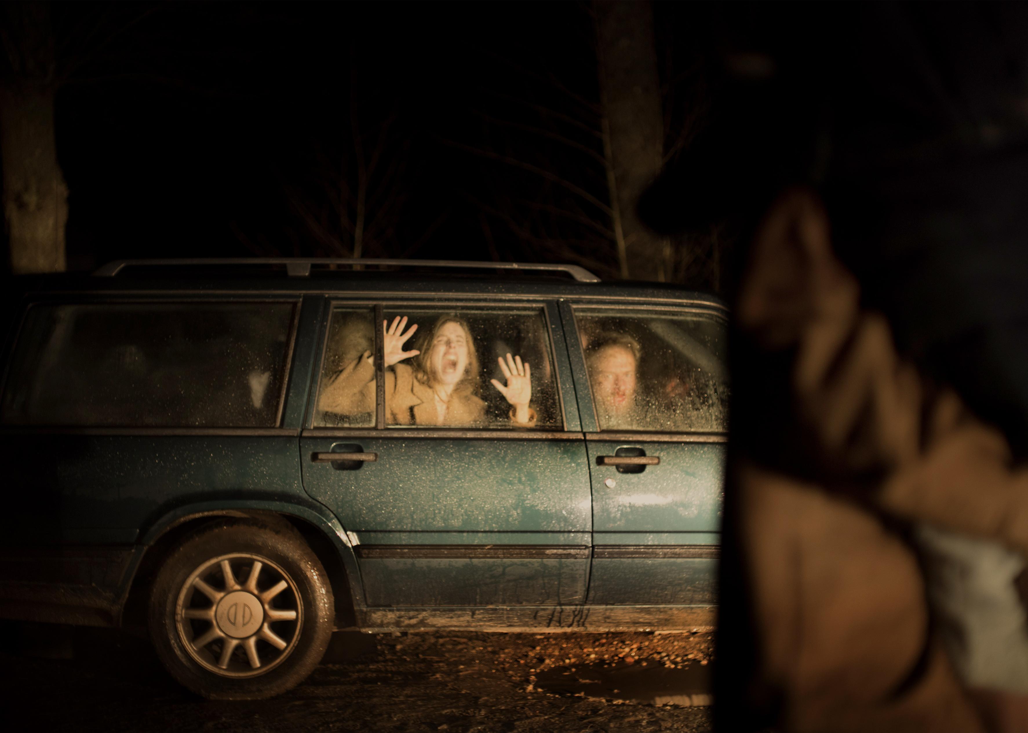 People screaming in horror in a volvo wagon