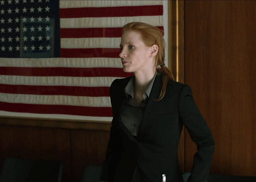 Jessica Chastain in front of an American flag.
