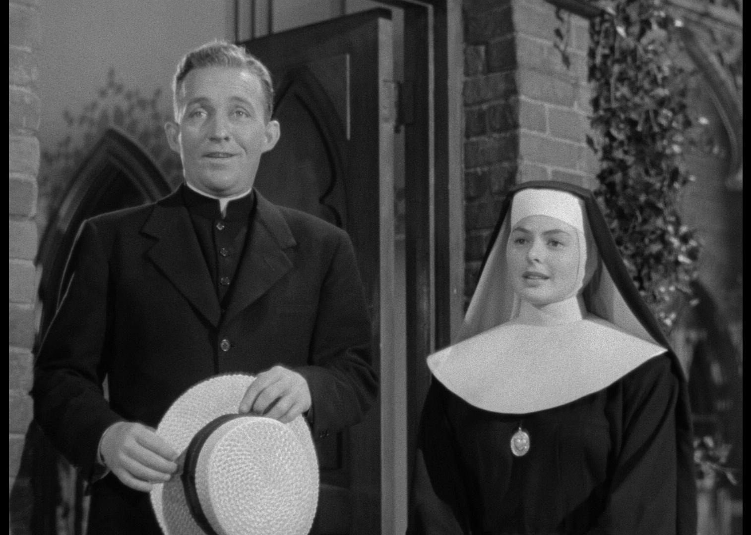 Ingrid Bergman, dressed as a nun, and Bing Crosby, holding a hat, standing together.