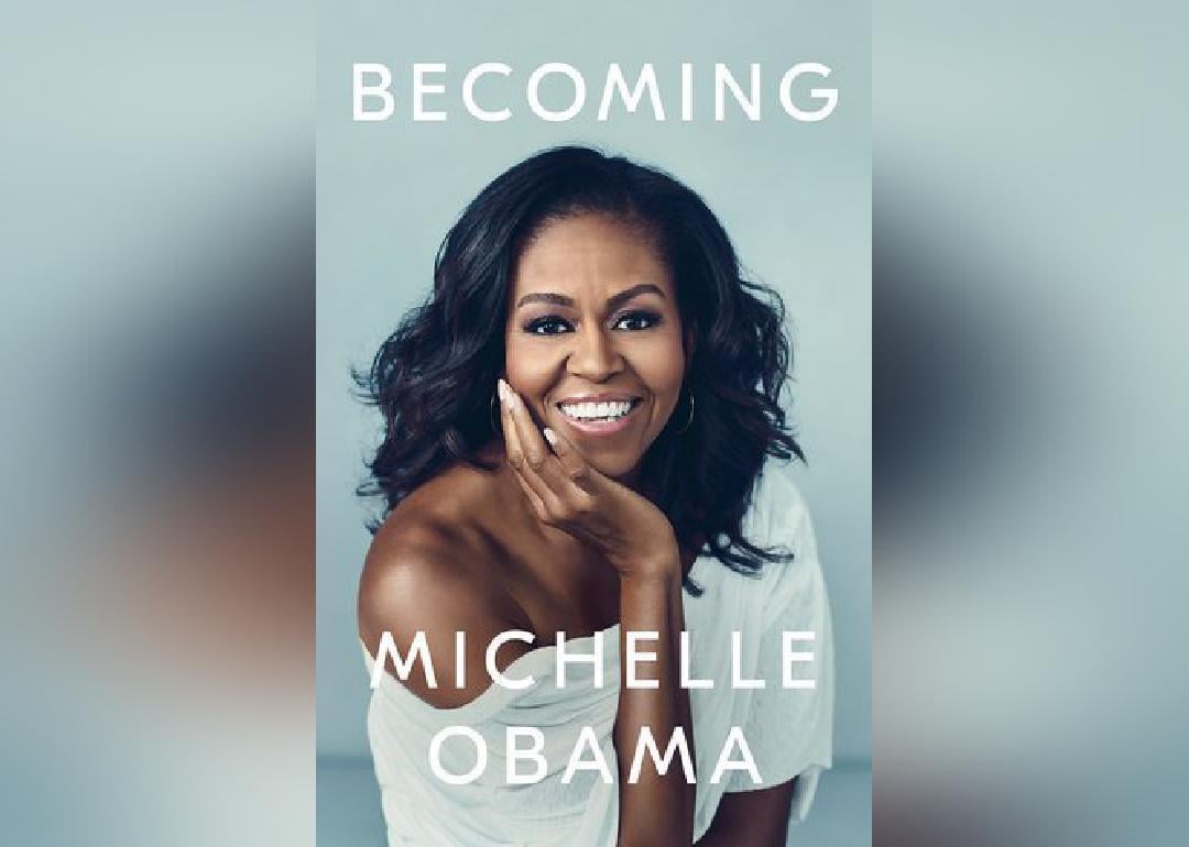Michelle Obama in a white off the shoulder top.