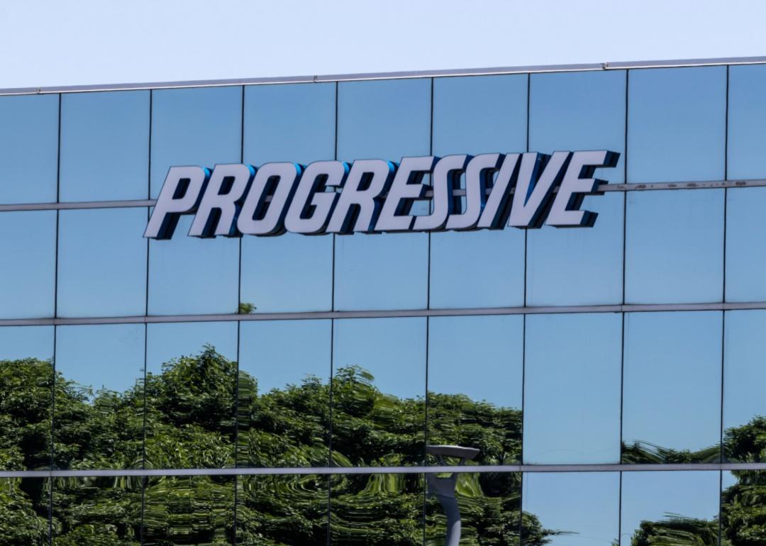 A glass Progressive Insurance building.