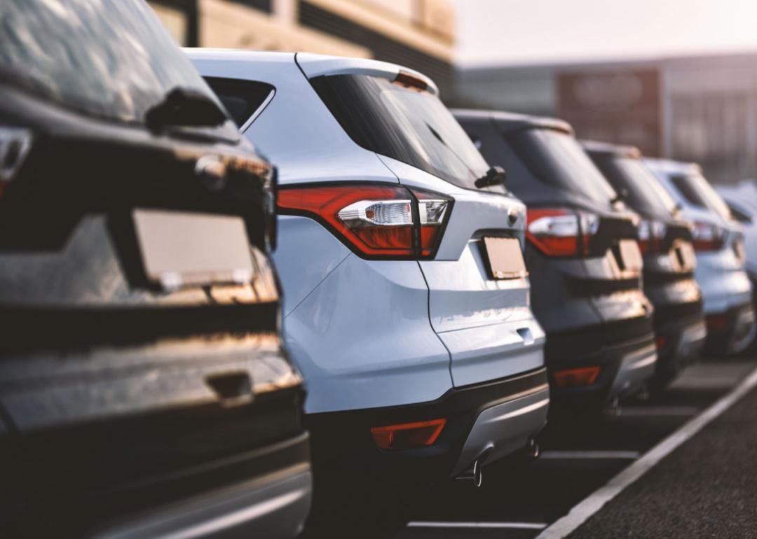 A row of small SUVs parked outside. 