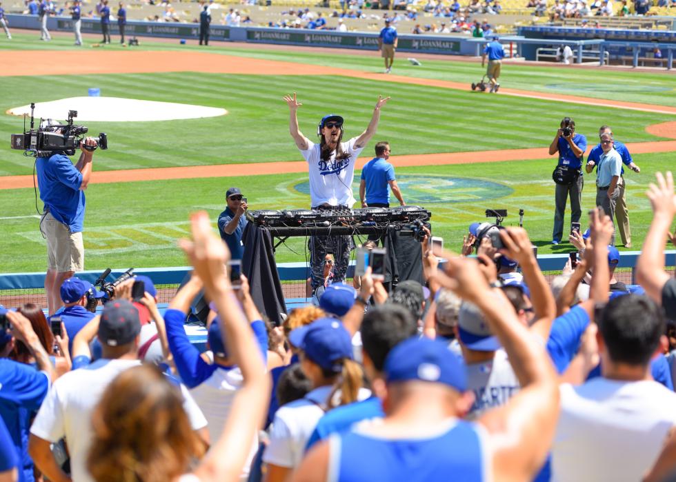 Steve Aoki deejays before a baseball game between the Colorado Rockies and the Los Angeles Dodgers at Dodger Stadium on April 19, 2015 in Los Angeles, California.