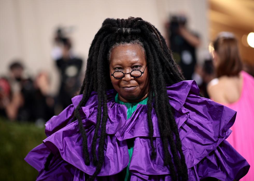 Whoopi Goldberg in a fluffy purple gown.