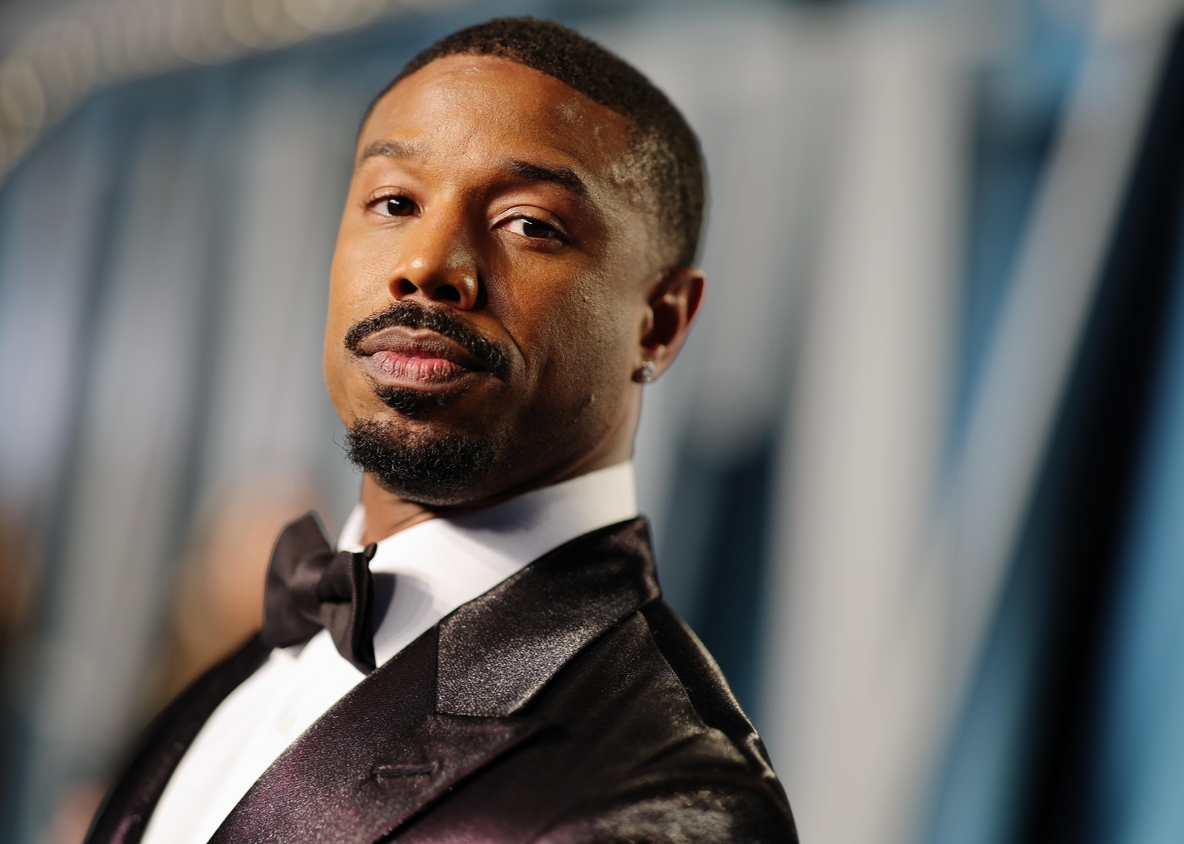 Michael B. Jordan in a black suit and bowtie.