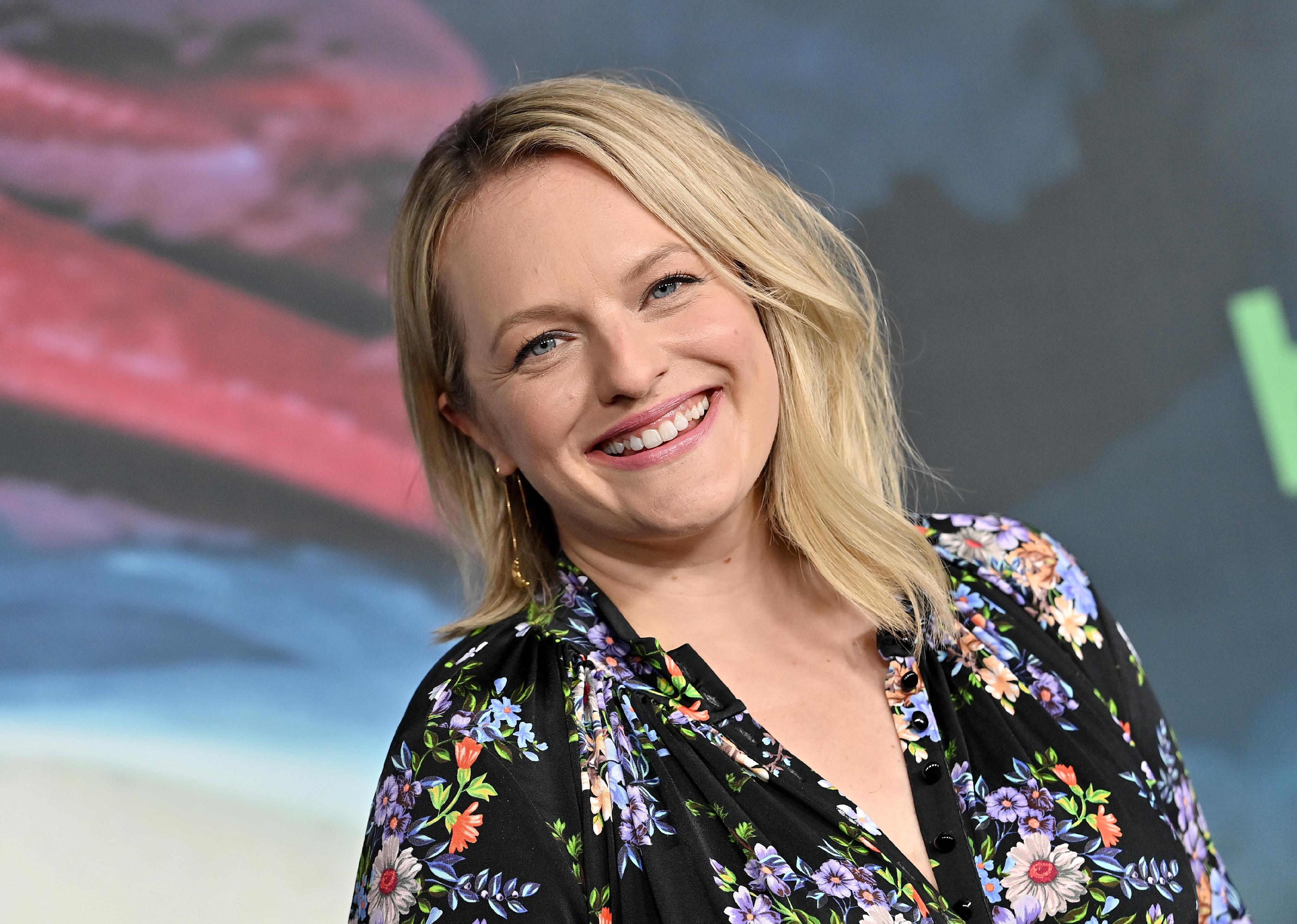 Elisabeth Moss in a floral dress.