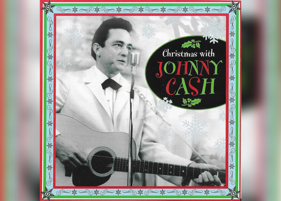 Johnny Cash, in black and white, playing the guitar on the cover of the album.