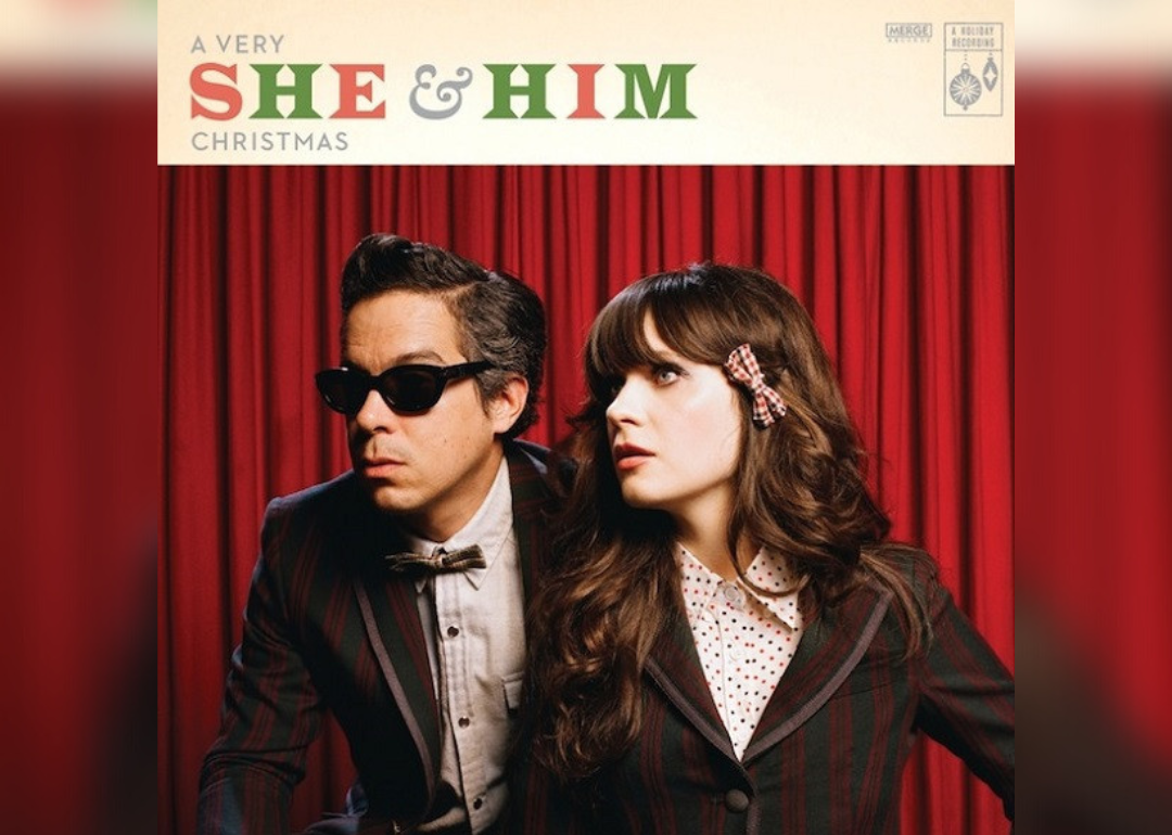 The album cover features Zooey Deschanel and M. Ward in green and red suit jackets in front of a red curtain.