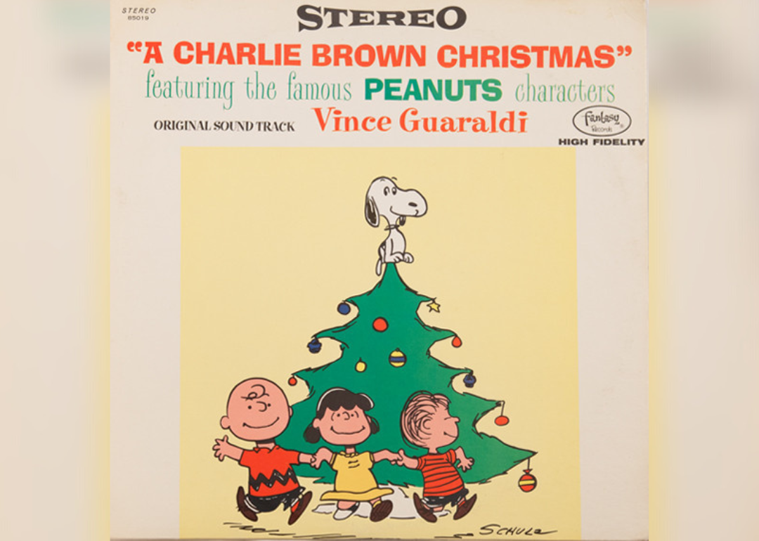 The album cover features a cartoon cast of Charlie Brown dancing around a Christmas tree.