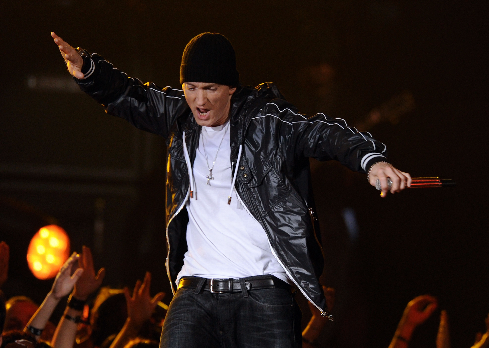 Eminem dancing in black and white onstage.