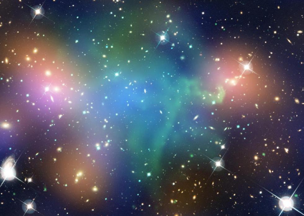Composite image shows the distribution of dark matter, galaxies, and hot gas in the core of the merging galaxy cluster Abell 520.