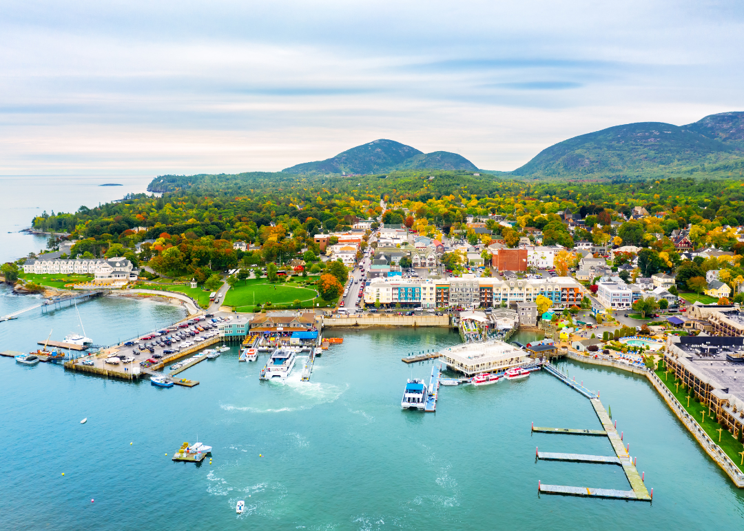 An aerial view of homes and boats in Bar Harbor on the water.