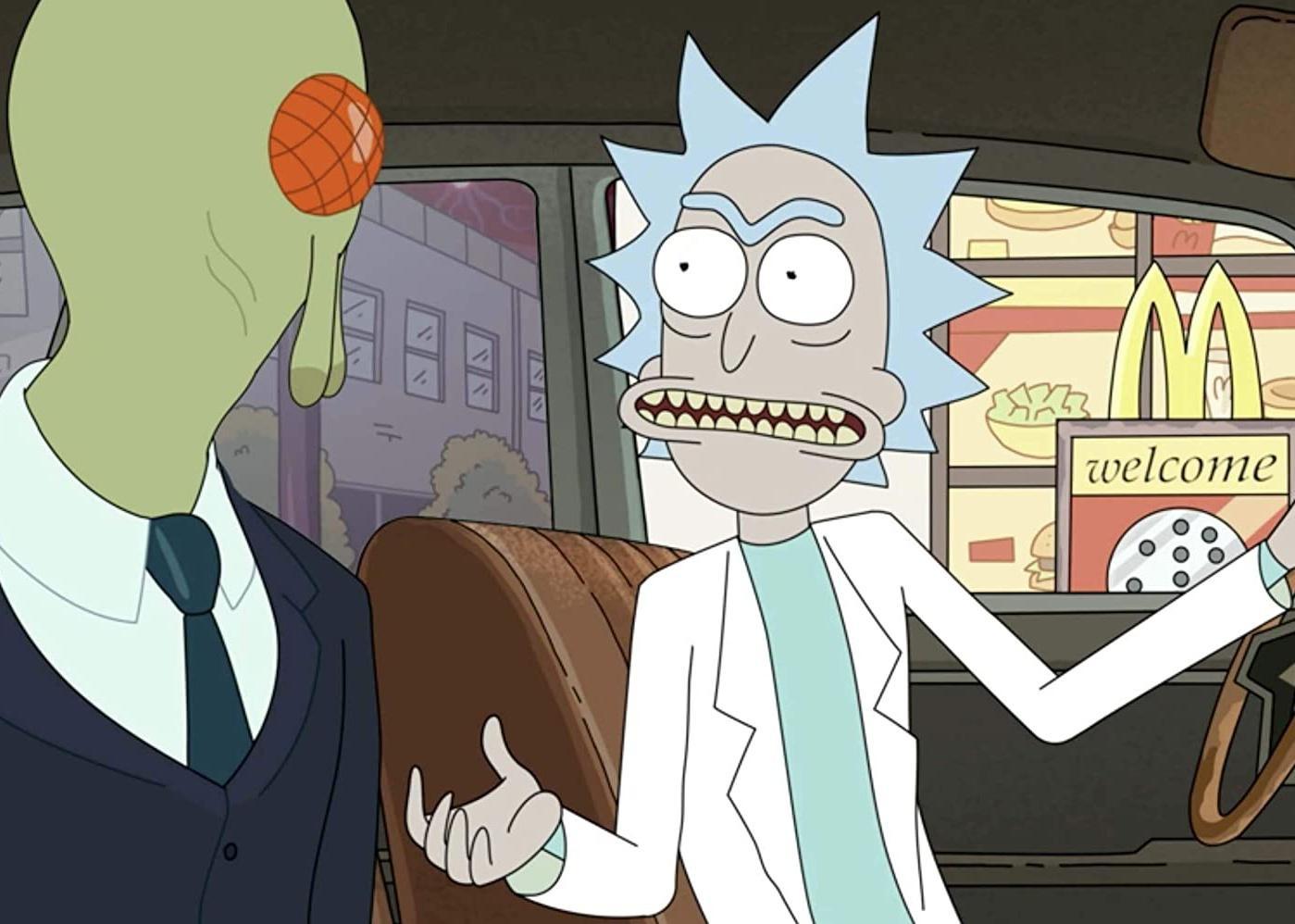 A cartoon of a man with spikey gray hair and an alien in a suit getting fast food at a drive-thru.
