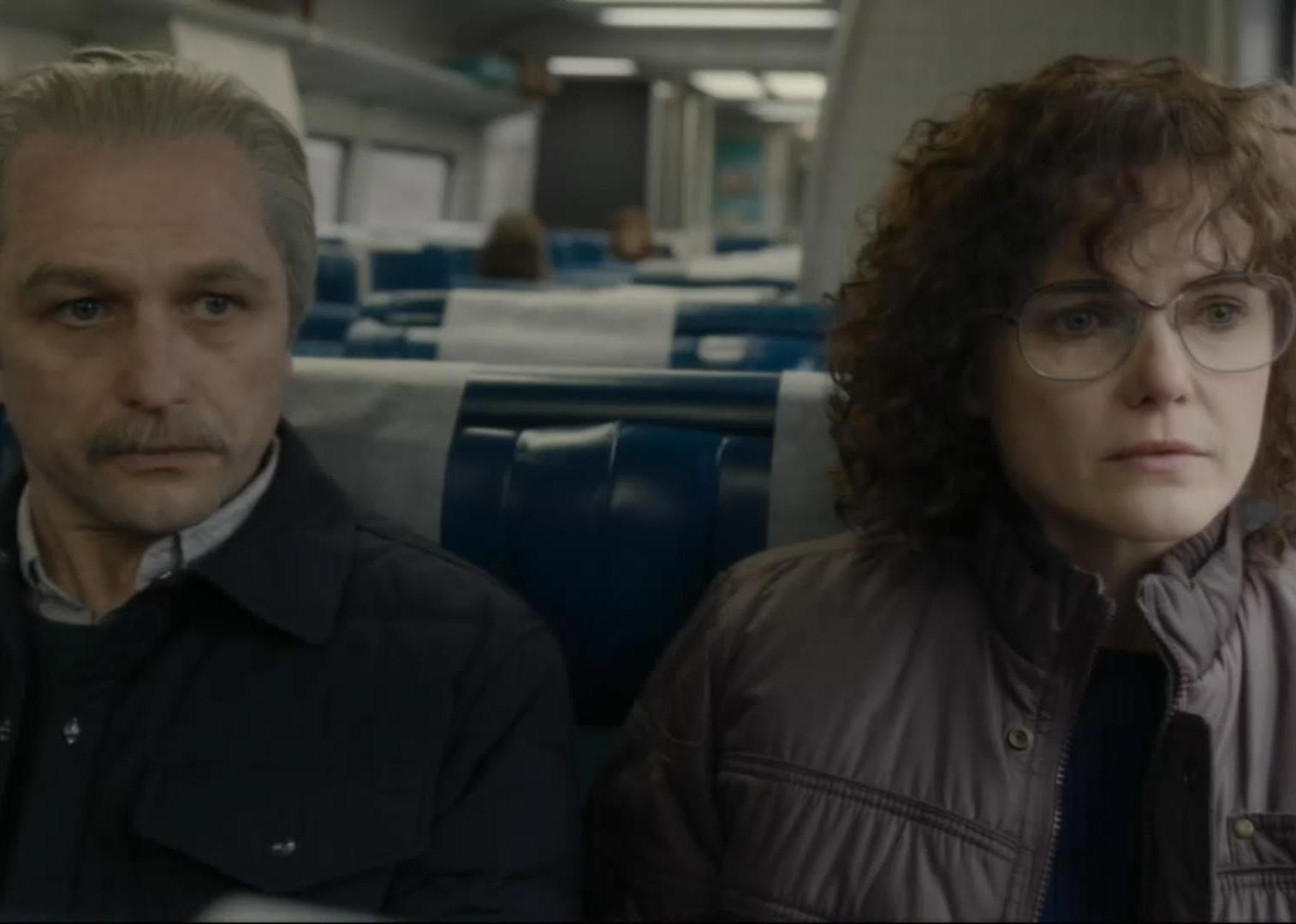Keri Russell and Matthew Rhys on a train together.