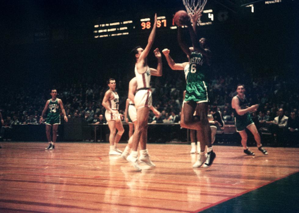 Bill Russell goes for a lay-up