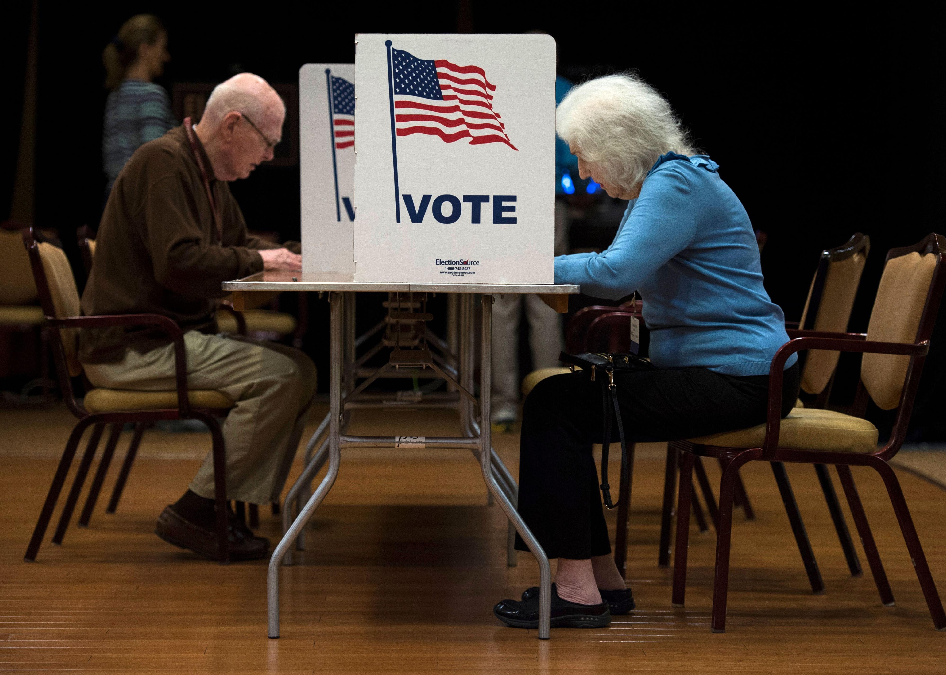 People vote at the Greenspring Retirement center during the mid-term election day in Fairfax, Virginia 