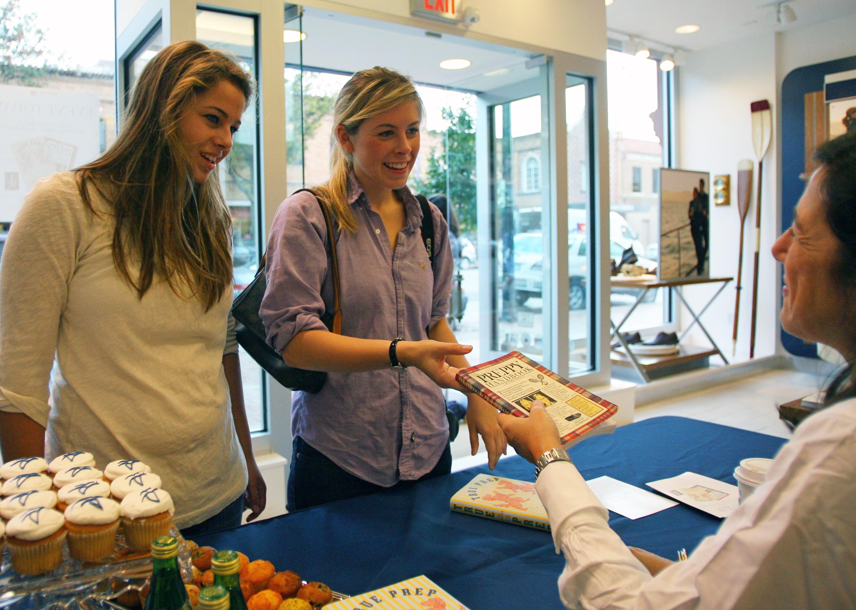  Author Lisa Birnbach signs copies of her book.