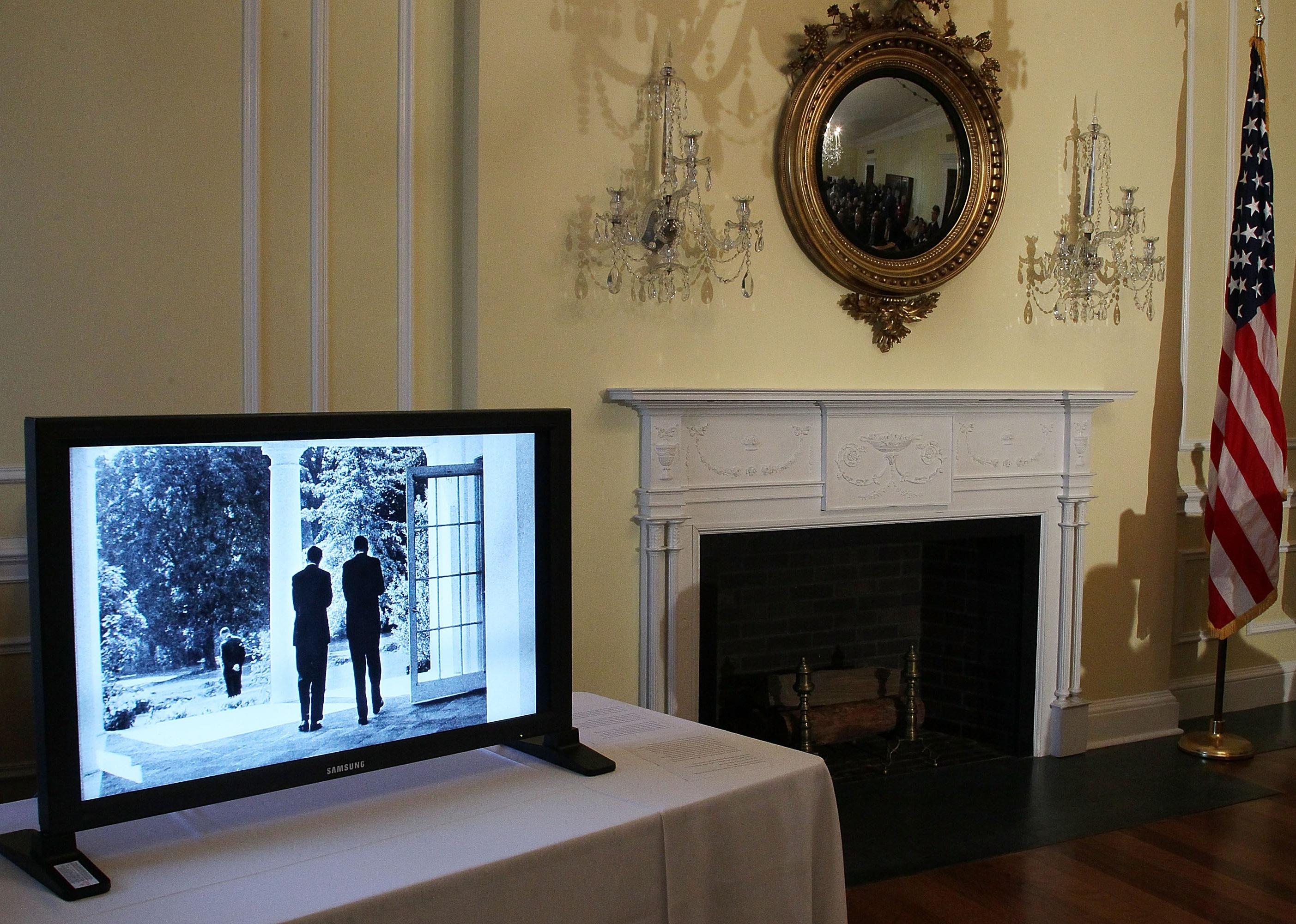 Images from the John F. Kennedy archive website are shown on a monitor 