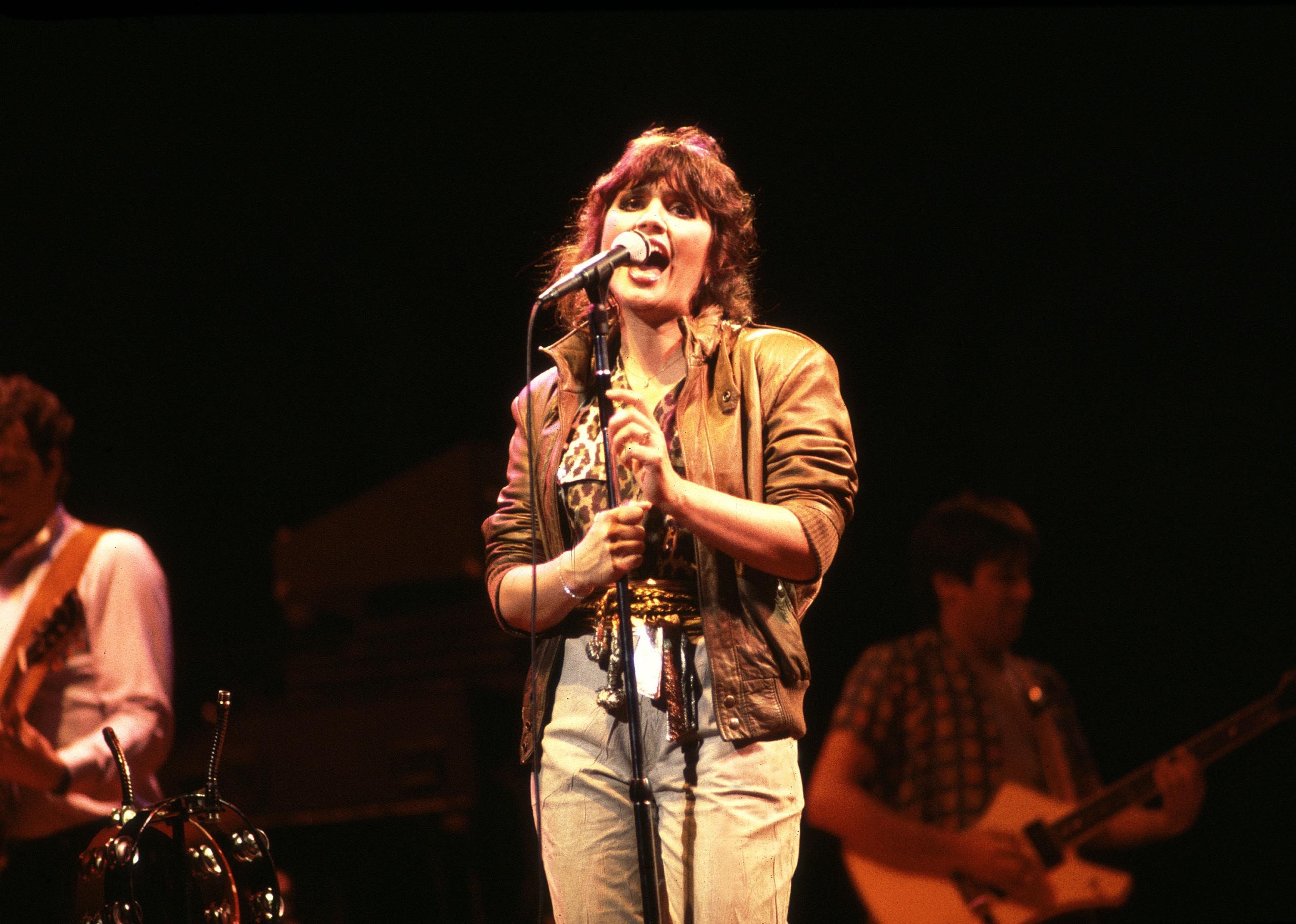 Linda Ronstadt performing on stage.