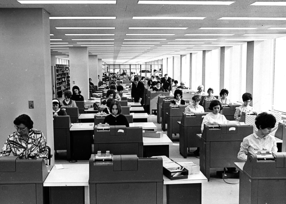 Employees work in an office inside the John F. Kennedy Federal Building