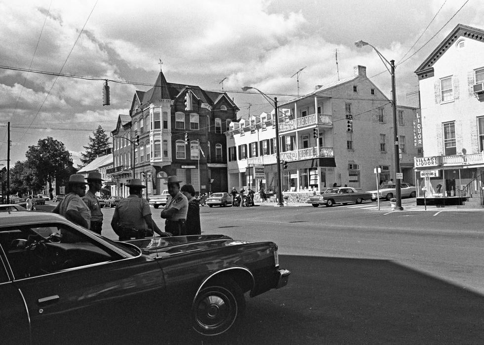 Law enforcement officers standing at the intersection of Seton Avenue and Main Street in Emmitsburg, Maryland.