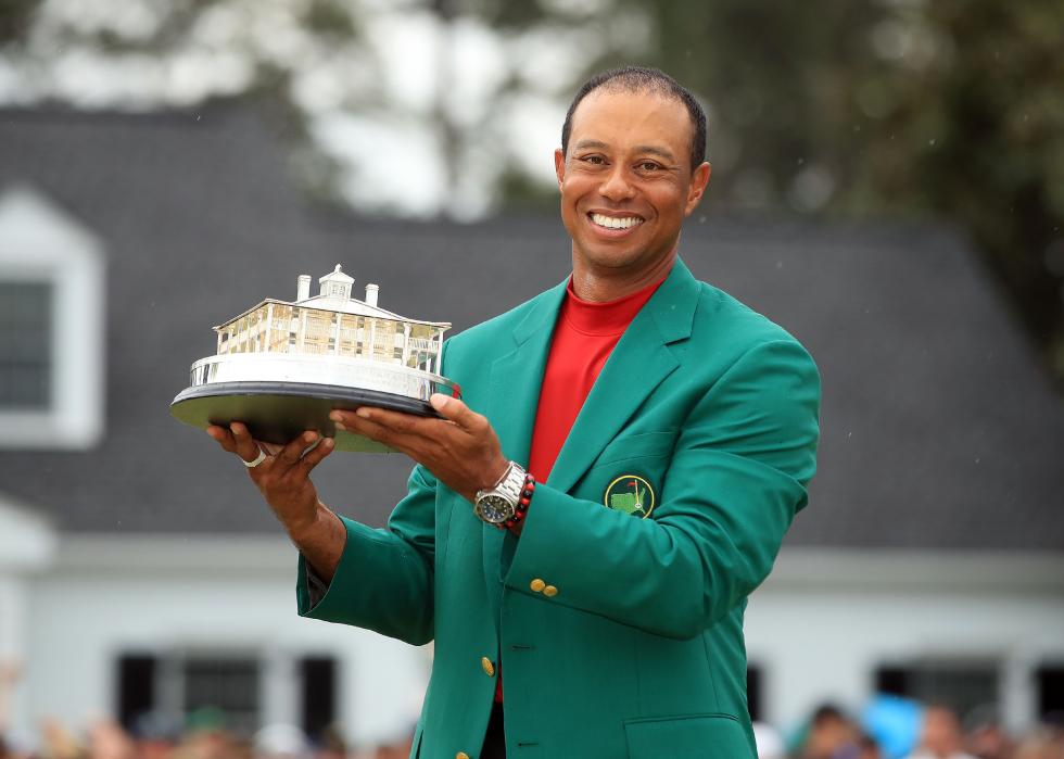 Tiger Woods celebrates with the Masters Trophy