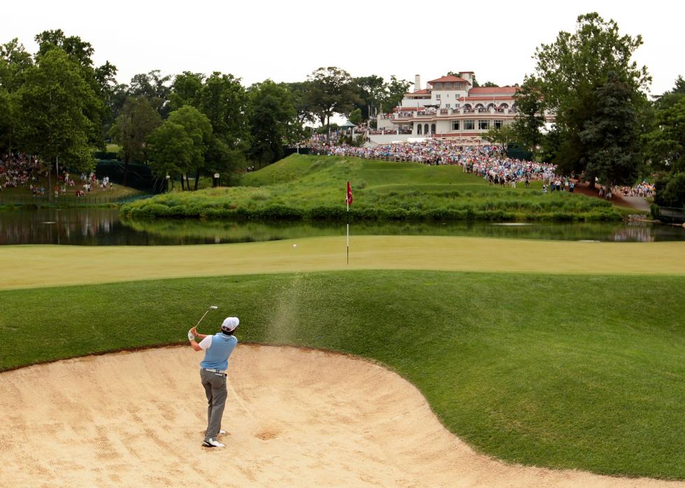 Rory McIlroy plays a bunker shot during the third round of the 111th U.S. Open