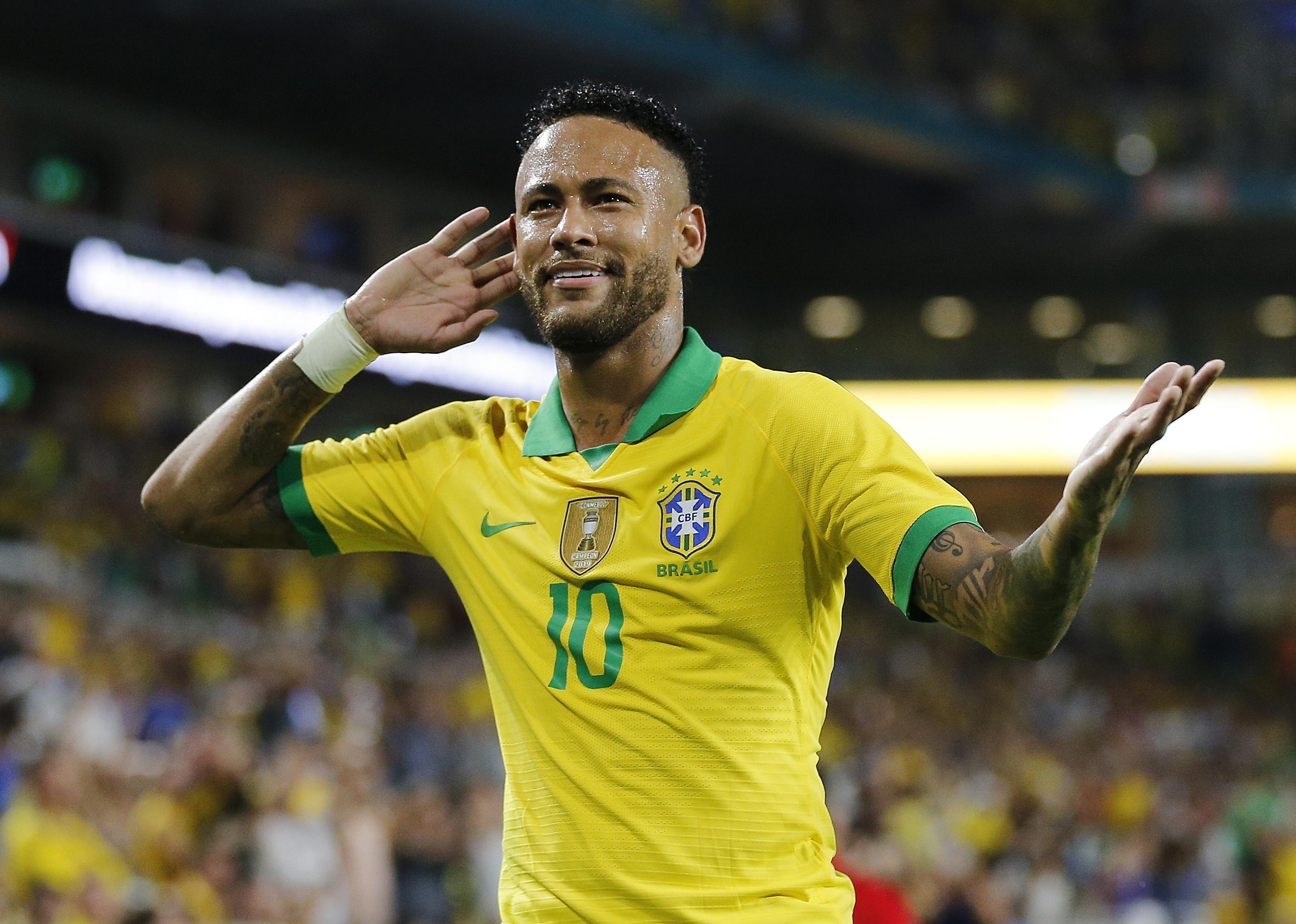 Neymar Jr. of Brazil reacts after assisting on a goal