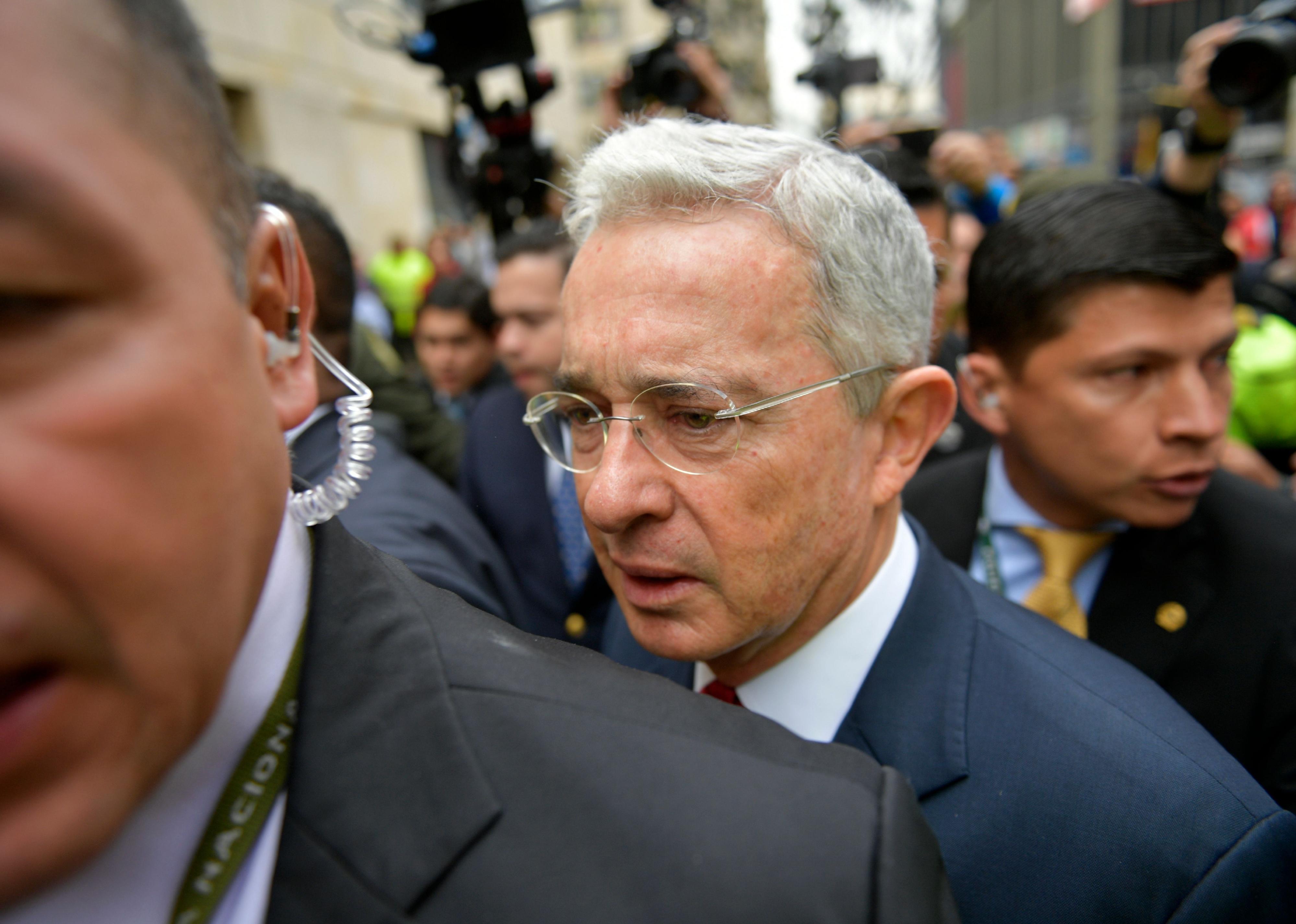 Alvaro Uribe arrives to the Palace of Justice for a hearing before the Supreme Court of Justice