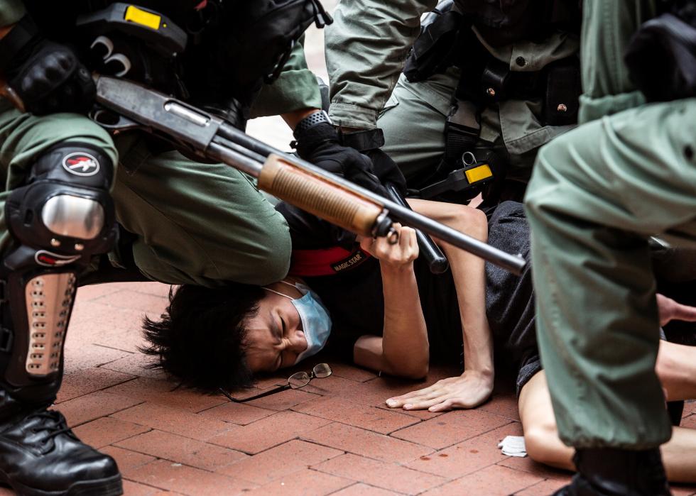 Protesters are arrested by police in Hong Kong