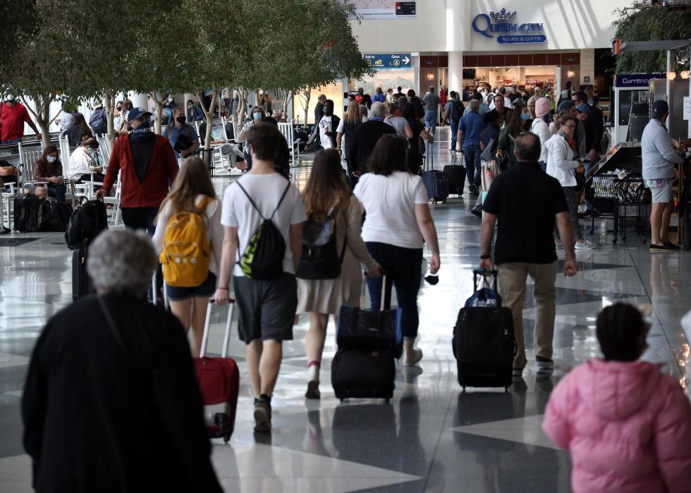 Passengers walk between terminals at Charlotte Douglas International Airport 