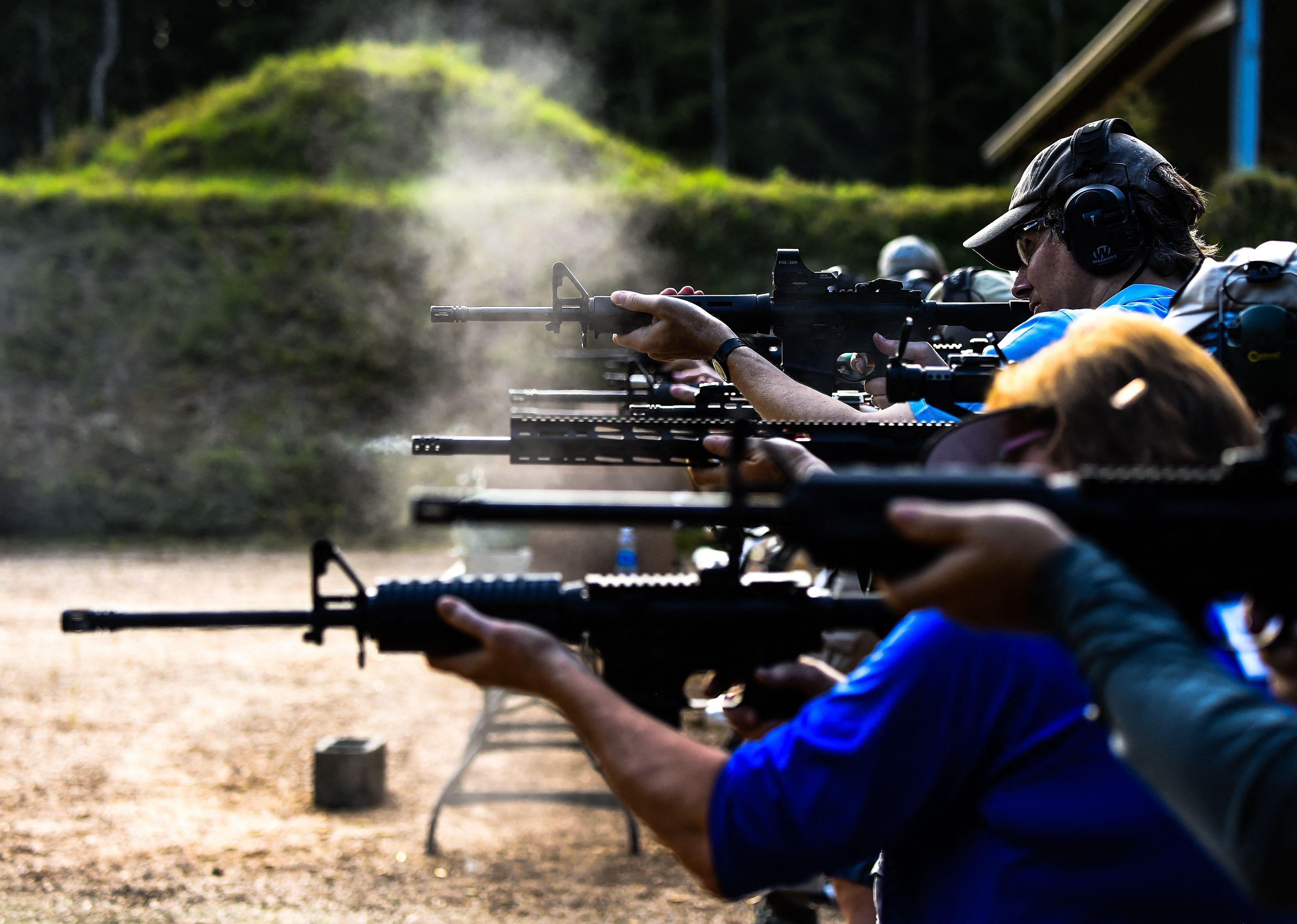 Students fire AR-15 semi-automatic rifles during a shooting course.