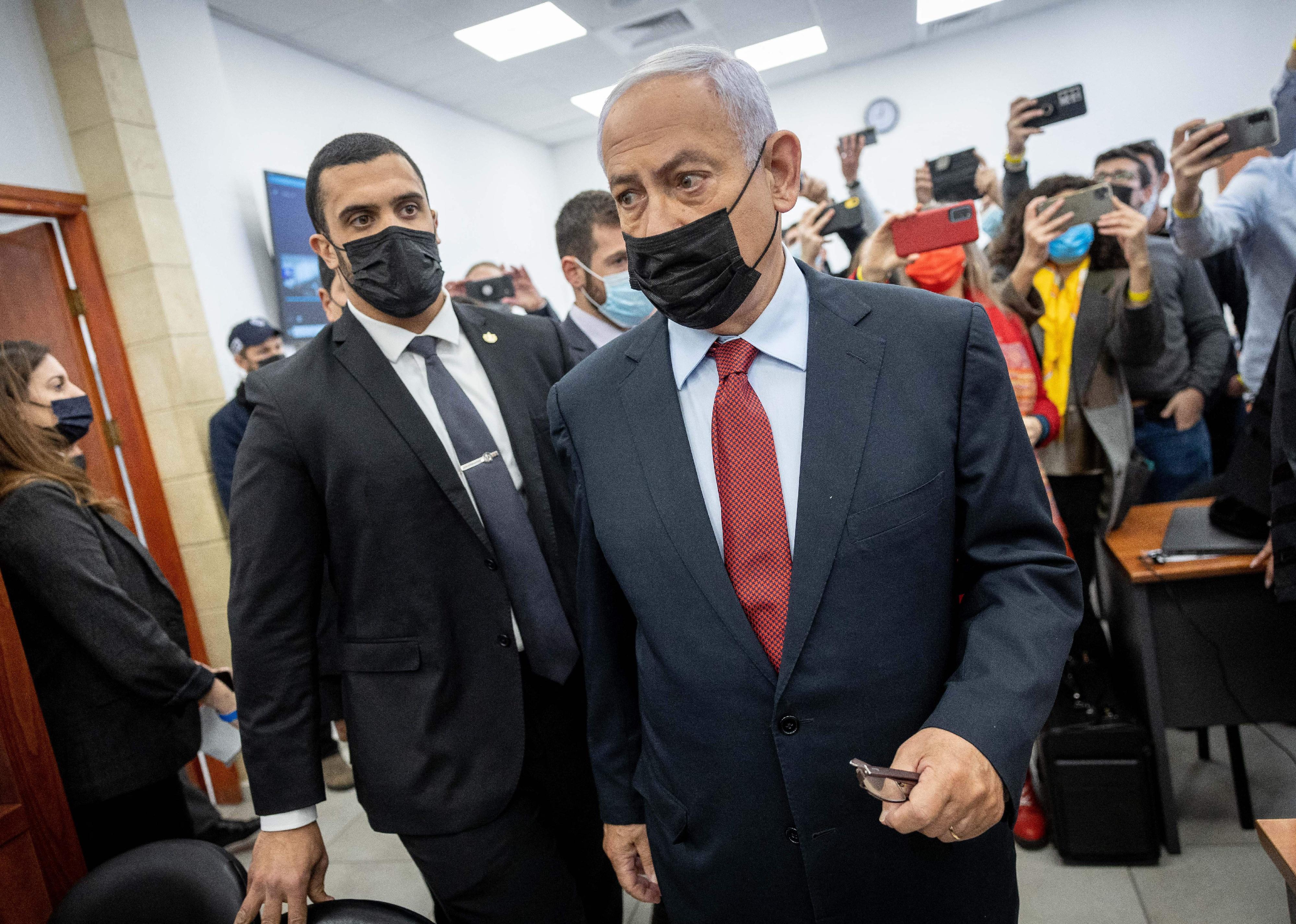 Benjamin Netanyahu stands at the courtroom in the Jerusalem District Court