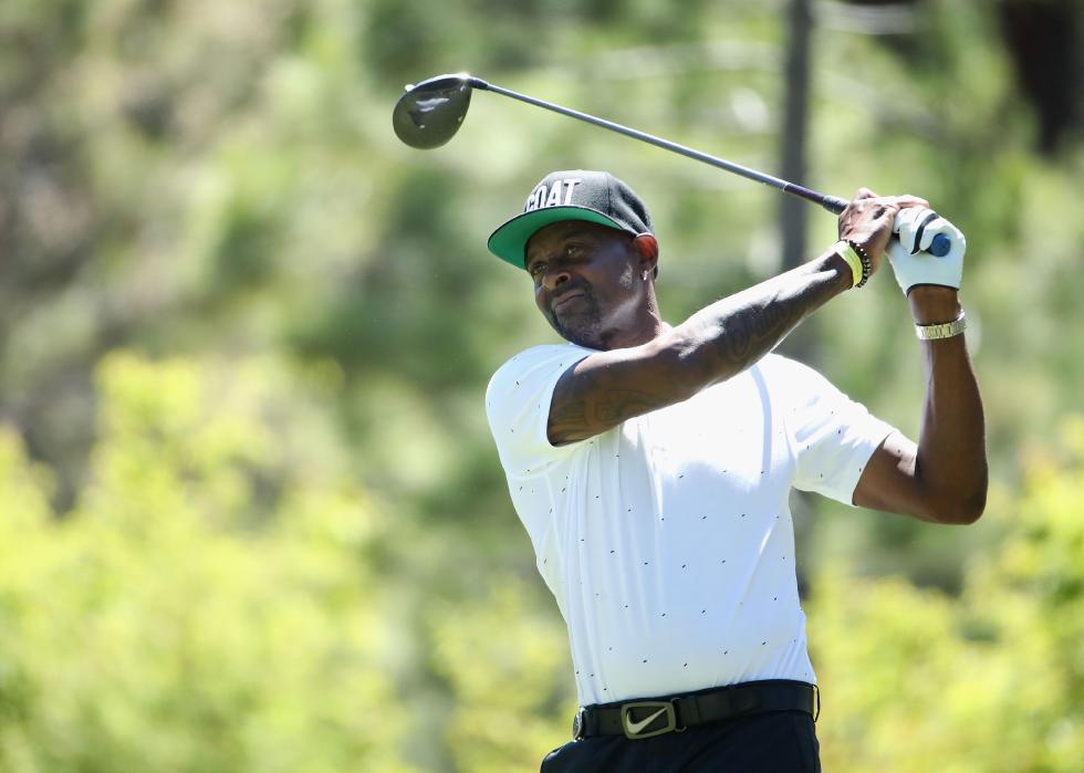 Jerry Rice plays a tee shot on the ninth hole 